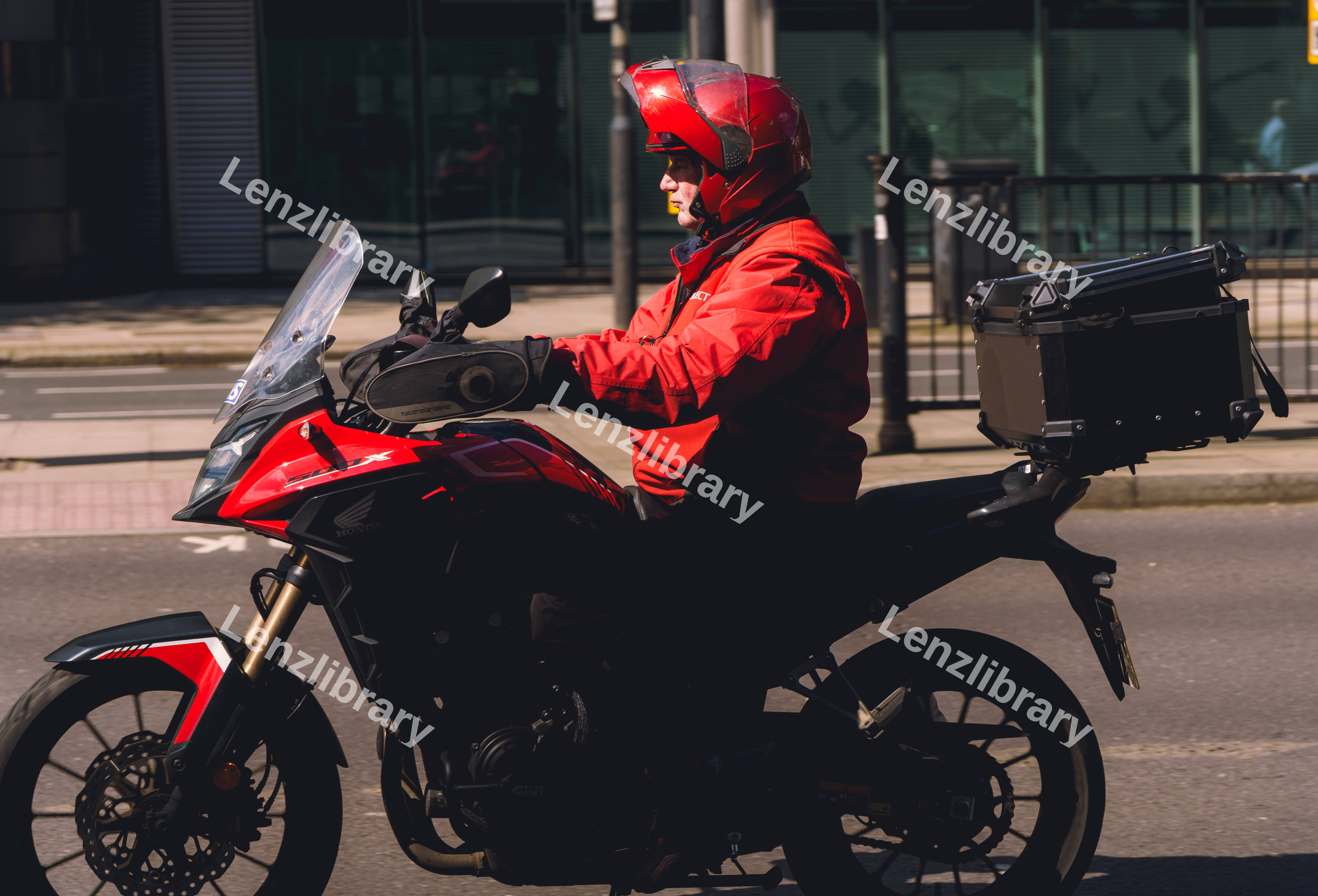Man In Red On Motorcycle